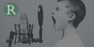 Boy crying out into a retro microphone